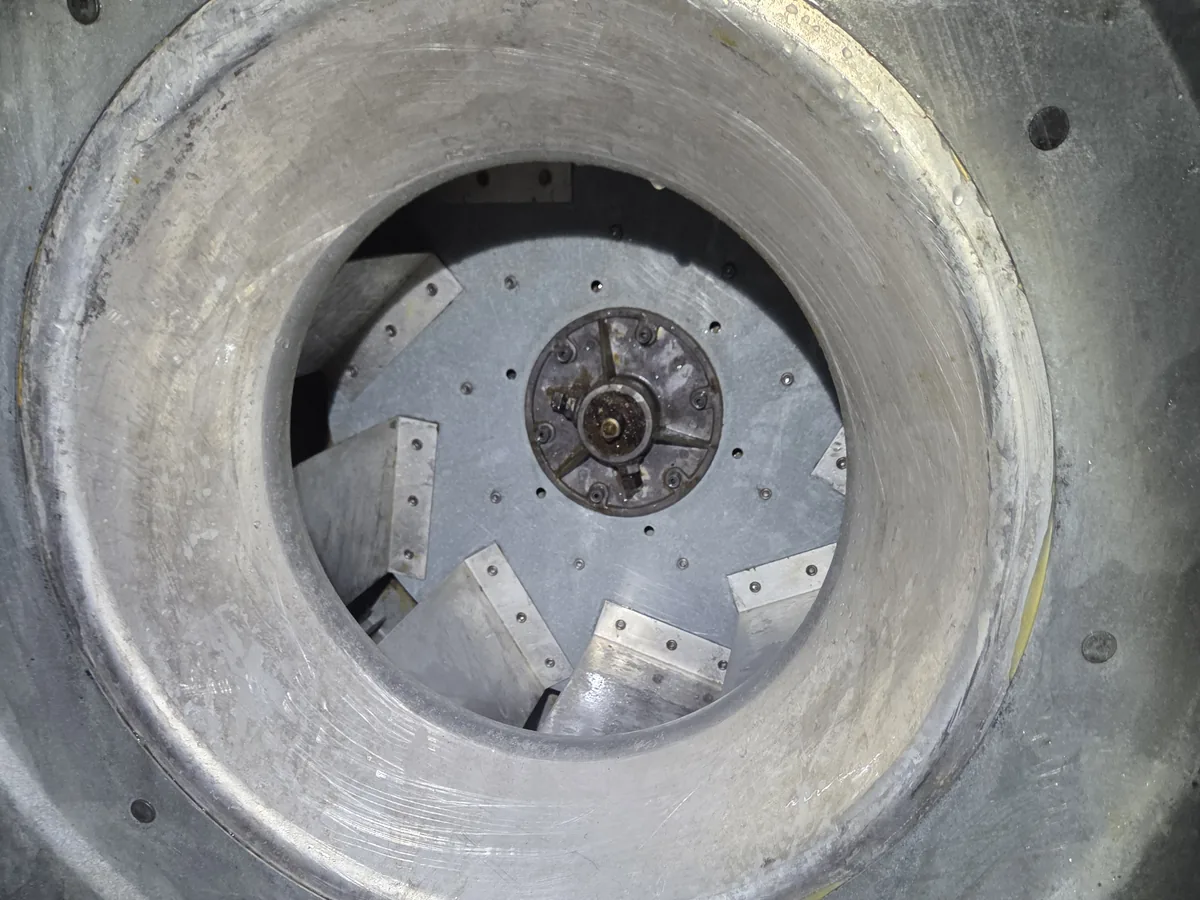 The same exhaust fan wheel and housing cleaned back to bare metal