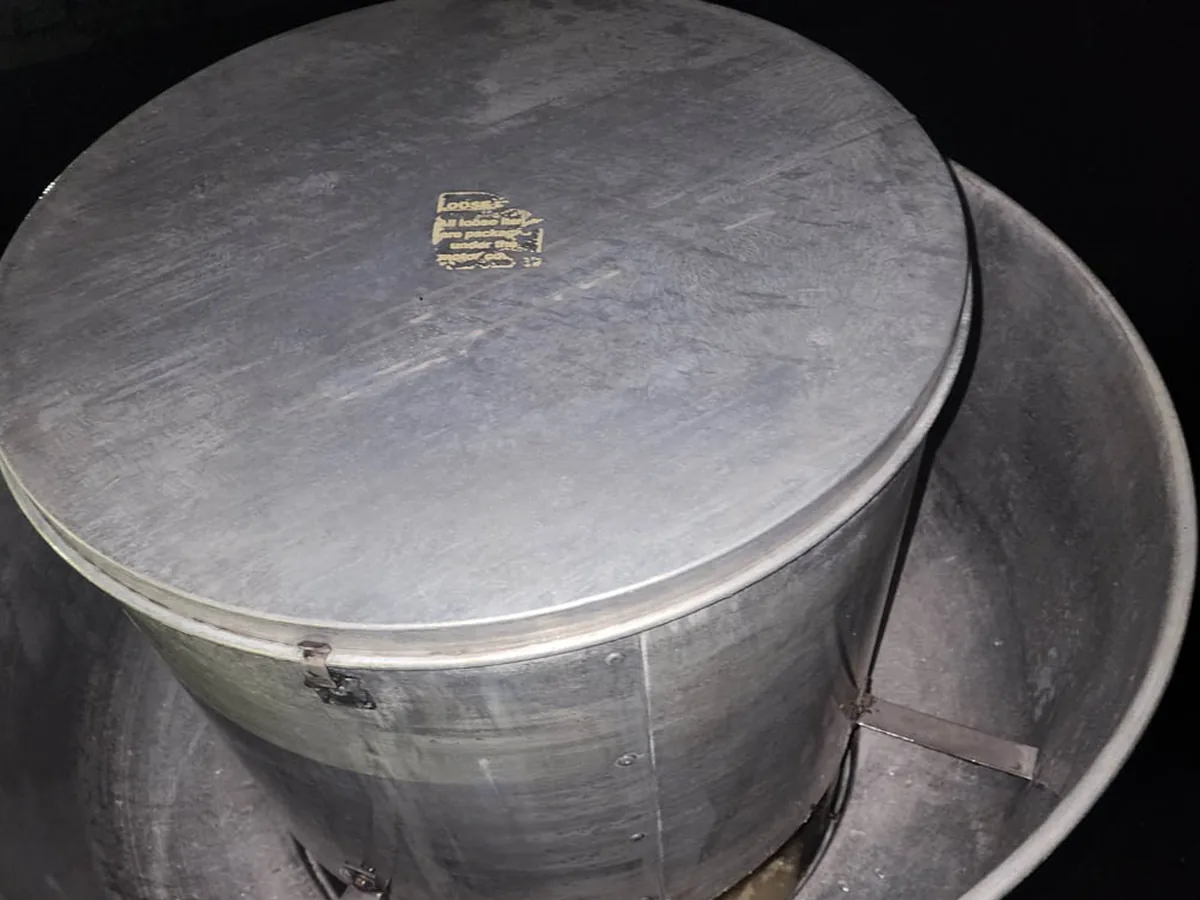 The same rooftop exhaust fan cleaned back to bare metal